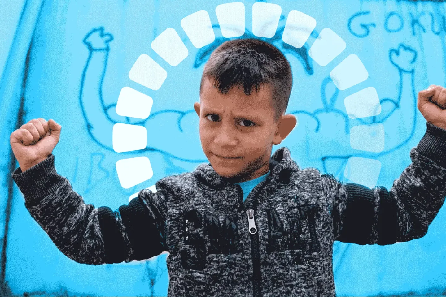 A boy from the local ROMA community in the centre's playground against a blue-washed background.