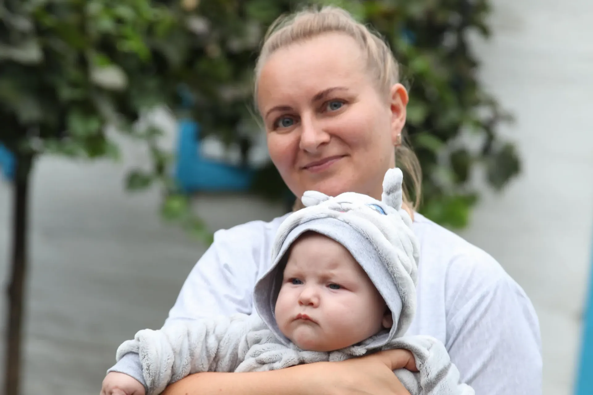 Woman holding baby.