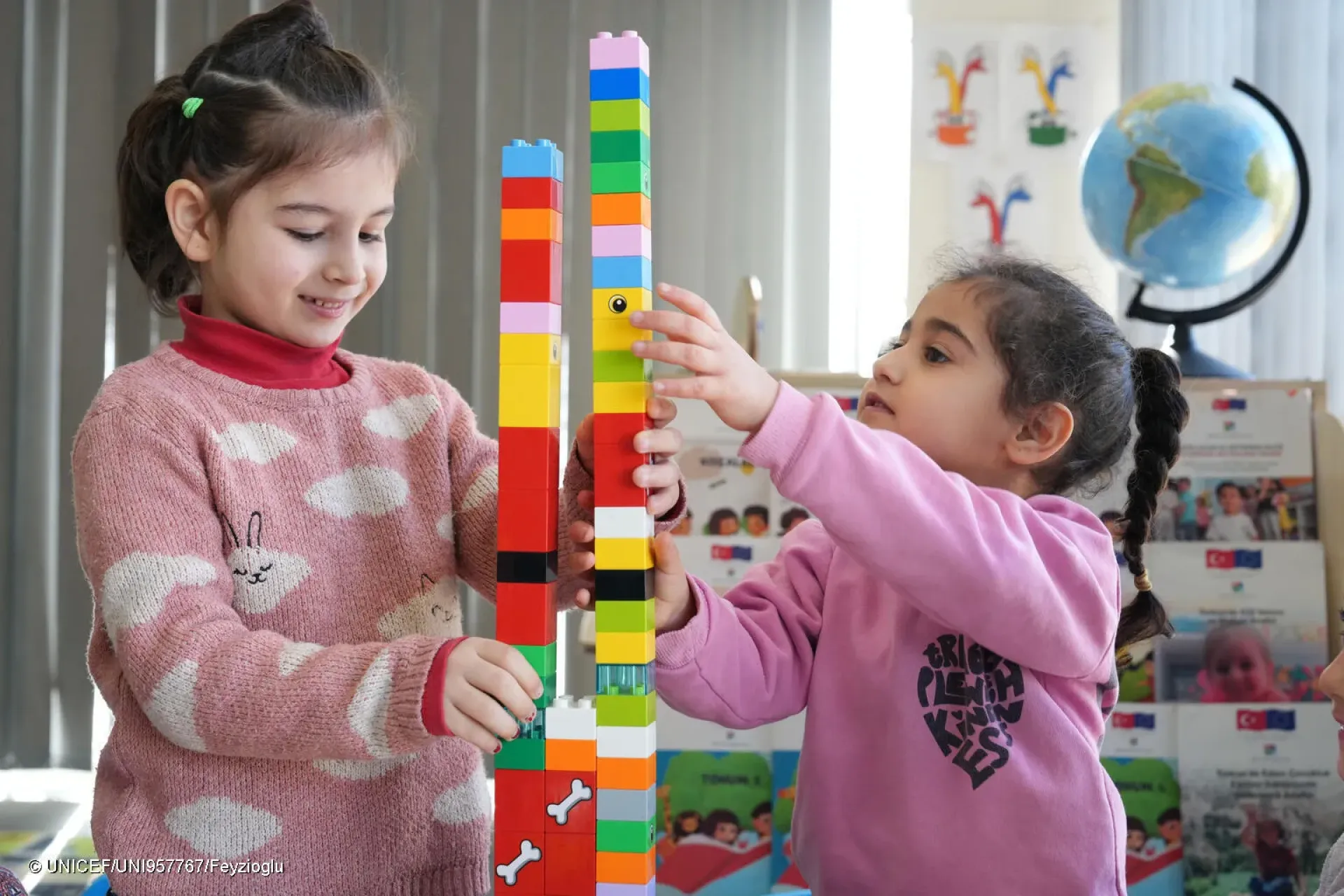 Two girls playing with bricks in an ECE classroom