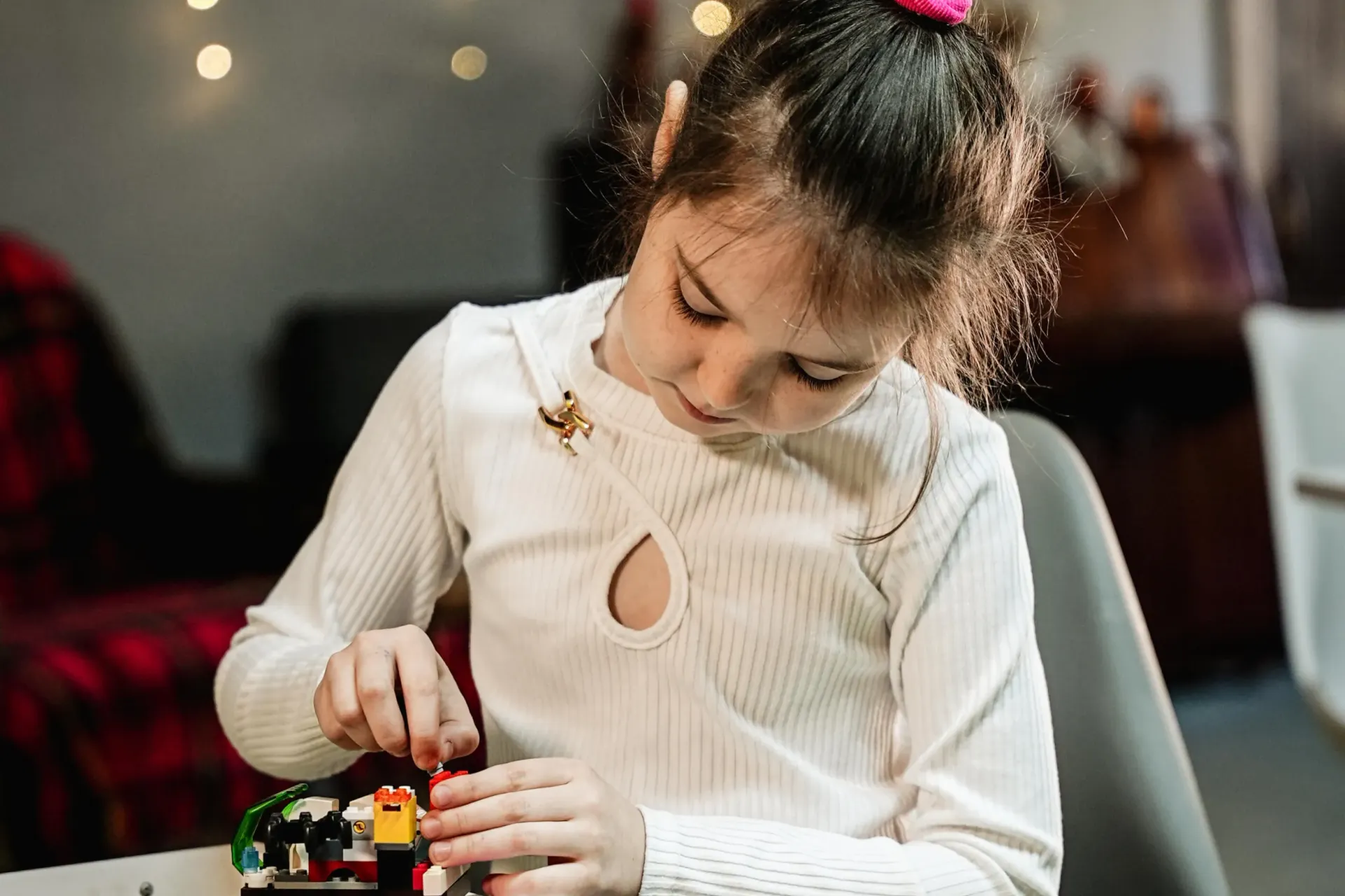 Girl playing with lego.